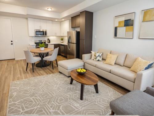 a living room with a couch and a table at Downtown Los Angeles Modern Apartments in Los Angeles