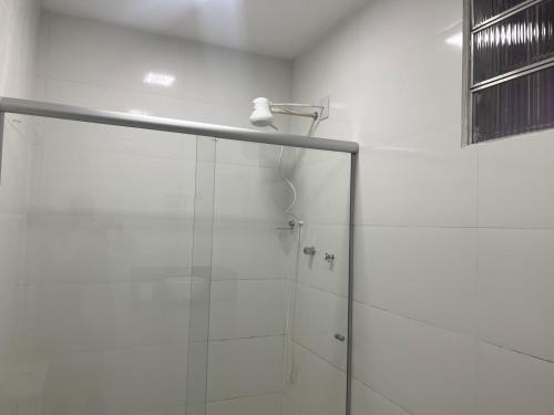 a shower with a glass door in a bathroom at Casa do Alessandro in Vila Velha