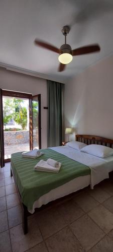 Ένα ή περισσότερα κρεβάτια σε δωμάτιο στο Doma Apartments 