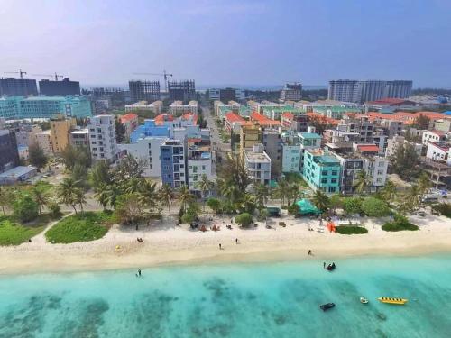 an aerial view of a beach and a city at Rara HM in Male City
