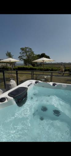 a jacuzziificialificialificialificialificialificialificialificialificialificialificial at Modern 5 Bedroom Luxury Home with Sea Views and Hot Tub in North Hayling
