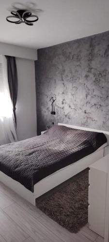 Ένα ή περισσότερα κρεβάτια σε δωμάτιο στο LCB Apartments P Victoriei Ploieşti