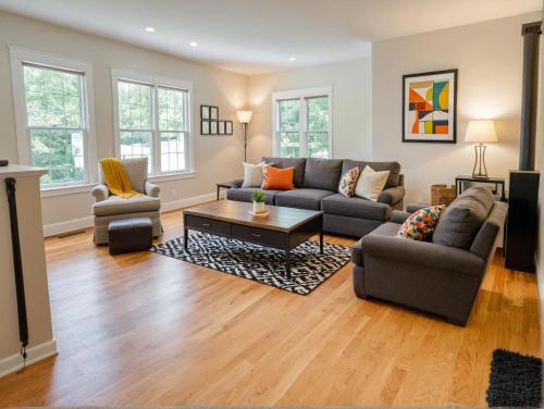 a living room with a couch and a table at Downtown Los Angeles Modern Apartments in Los Angeles