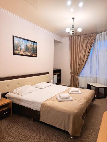 Krevet ili kreveti u jedinici u okviru objekta Central Hotel