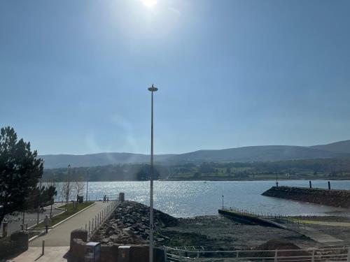 a view of a body of water with a street light at Aurora House 2B Warrenpoint in Newry