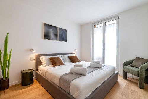 Una cama o camas en una habitación de Stupendo appartamento nel cuore di Bormio con WiFi