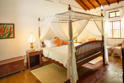 Ένα ή περισσότερα κρεβάτια σε δωμάτιο στο Eladetta Walauwa