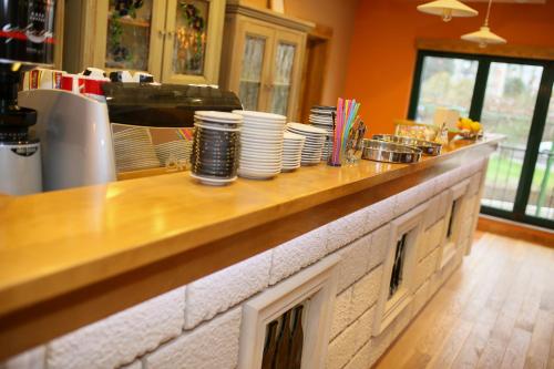 a kitchen counter with plates on top of it at Villa Salvia in Mostar