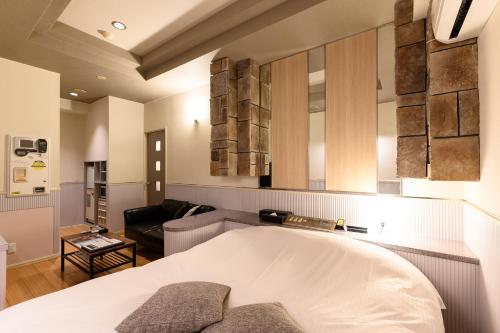 Ένα ή περισσότερα κρεβάτια σε δωμάτιο στο WEST INN hotel