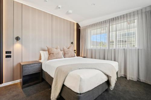 Postel nebo postele na pokoji v ubytování Sai Motels - Greenlane Auckland
