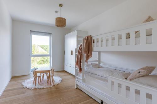 Giường trong phòng chung tại Vakantiewoning Sable Dor