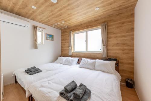 Ένα ή περισσότερα κρεβάτια σε δωμάτιο στο THE MAISON CHOUCHOU - Vacation STAY 16608v