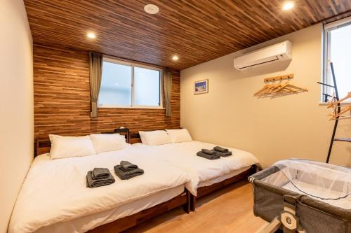 Ένα ή περισσότερα κρεβάτια σε δωμάτιο στο THE MAISON CHOUCHOU - Vacation STAY 16608v