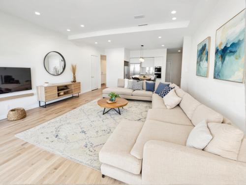 a living room with a couch and a table at Downtown Los Angeles Modern Apartments in Los Angeles