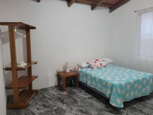 Giường trong phòng chung tại Luisa Rodriguez