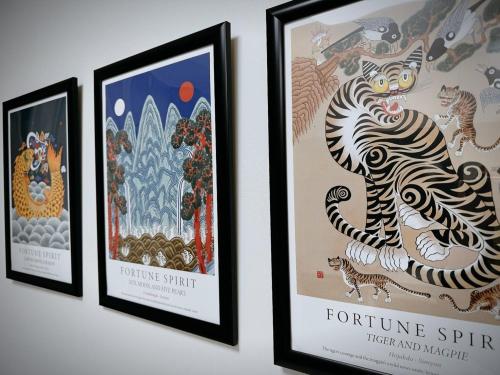 a group of three framed posters on a wall at Daejeon Dunsan Starworks in Daejeon