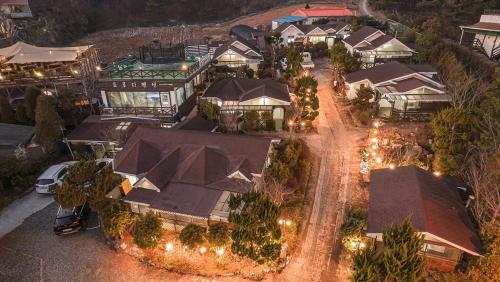 an aerial view of a house with lights at Taean Dokchae Trudy Pension in Taean