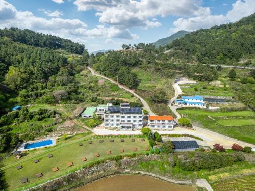 an aerial view of a resort on a hill at Namhae Camp Village in Namhae