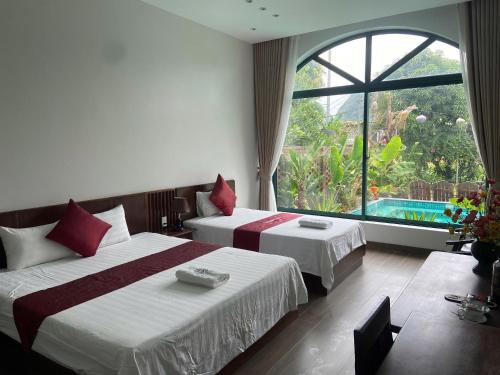 Ένα ή περισσότερα κρεβάτια σε δωμάτιο στο Tam coc MrHieu homestay