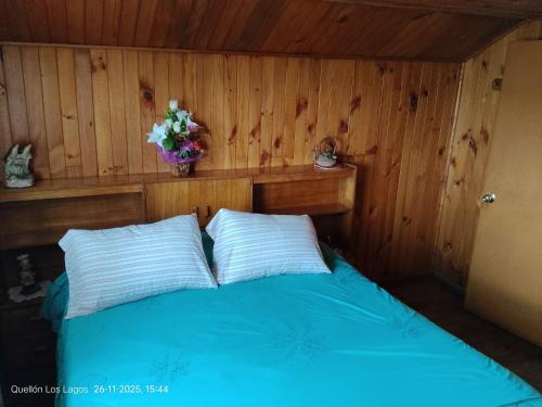 Ένα ή περισσότερα κρεβάτια σε δωμάτιο στο Hospedaje Mirador del Puerto