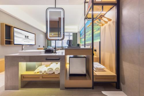 Μια τηλεόραση ή/και κέντρο ψυχαγωγίας στο 秋果酒店 东莞长安天地无限商务大厦店