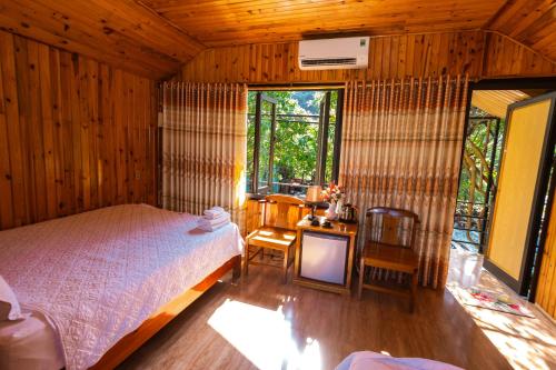 Ένα ή περισσότερα κρεβάτια σε δωμάτιο στο Phong Nha Bolero Bungalow