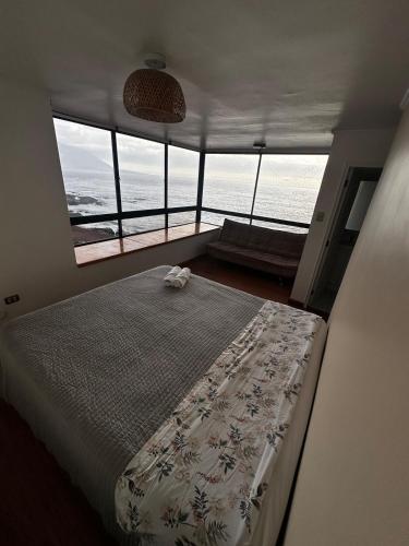 Ένα ή περισσότερα κρεβάτια σε δωμάτιο στο Apartment with spectacular ocean views
