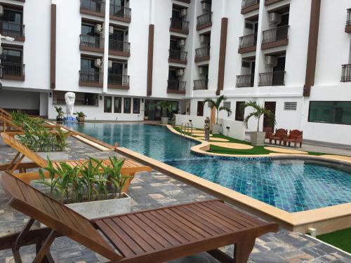 a swimming pool in the middle of a building at Baan Sang Singh in Chiang Mai