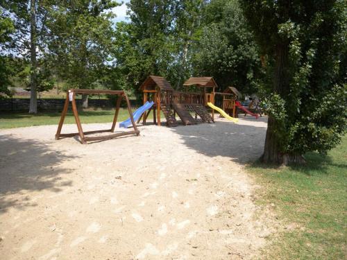 eine Gruppe von Spielgeräten in einem Park in der Unterkunft Holiday Homes in Balatonakali 37748 in Balatonakali