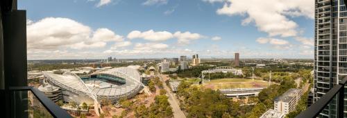 an aerial view of a city with a stadium at SkyHaus - City & Fireworks View 2 Bed Apartment in Sydney