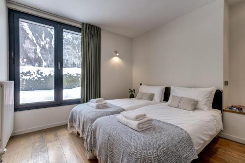 Ένα ή περισσότερα κρεβάτια σε δωμάτιο στο Chalet Safari. Face au Mont-Blanc.