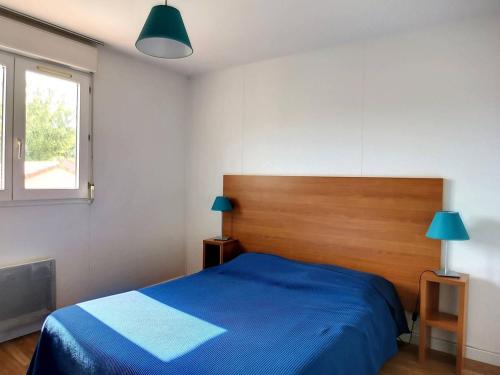 En eller flere senge i et værelse på Soustons Plage - Villa Duplex 6 pers avec terrasse - FR-1-857-32