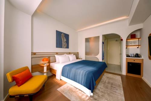 Ένα ή περισσότερα κρεβάτια σε δωμάτιο στο Savvy by M Village Hai Ba Trung - Saigon Downtown