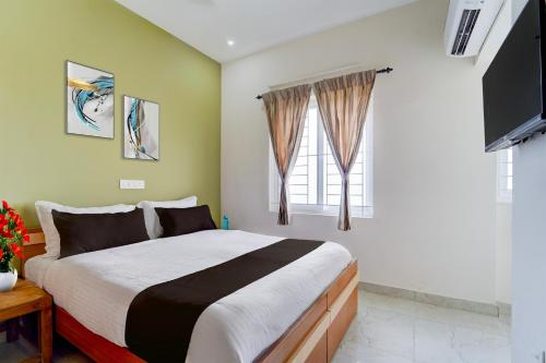 Ένα ή περισσότερα κρεβάτια σε δωμάτιο στο Townhouse Svb Tech Park Kalapatti Formerly RG Stays