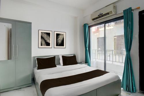 Una cama o camas en una habitación de Hotel O Kohinoor Park Hinjewadi