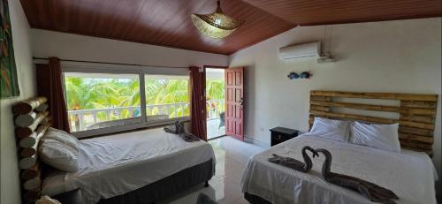 Llit o llits en una habitació de Coco Paradiso