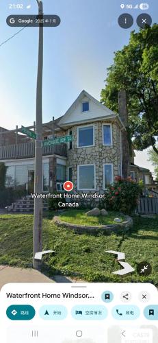 a house with a sign in front of it at Waterfront Home Windsor ,On, Ca in Windsor