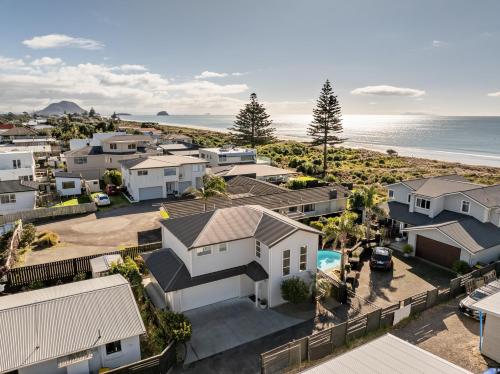 an aerial view of houses and the ocean at Endless Summer Retreat - Mt Maunganui in Mount Maunganui