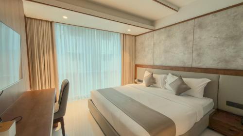 Un pat sau paturi într-o cameră la Hotel Bluebell