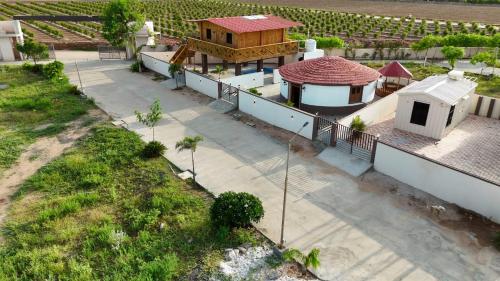 an overhead view of a house with a building at Aqua Dream Water Park in Bhuj