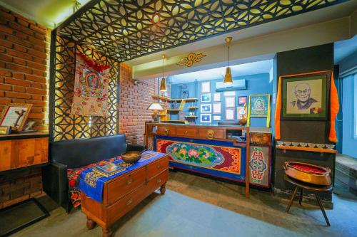 a room with a bed and a table in it at Open Hotel by Olive - Utse Suites in Bengaluru