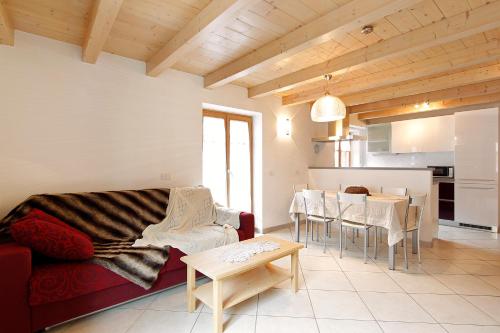 a living room with a couch and a table at Ciasa Savoy in Vigo di Fassa