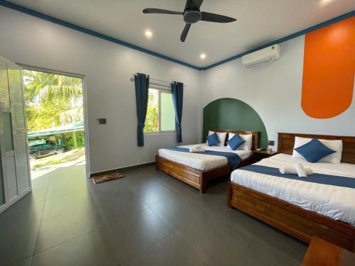 Ένα ή περισσότερα κρεβάτια σε δωμάτιο στο BIỂN ĐỒI Bungalow