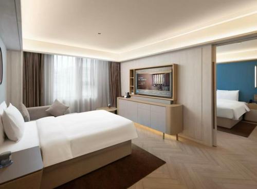 Fotografie z fotogalerie ubytování Orange Crystal Qingdao Taidong Pedestrian Street Yan'an Third Road Hotel v destinaci Čching-tao