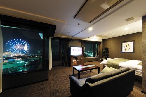 a hotel room with a large television and a bed at Hotel Water Gate Nagoya - Love Hotel for couple - in Nagoya