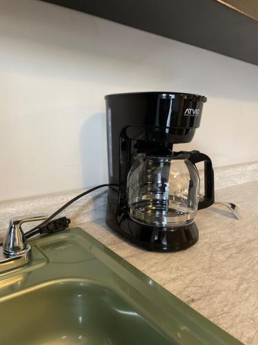 a coffee maker sitting on top of a counter at LiV109 Norte Depa 8 Cd Obregon in Ciudad Obregón