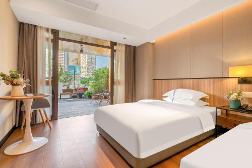 Ένα ή περισσότερα κρεβάτια σε δωμάτιο στο Yangji Yueya Hotel