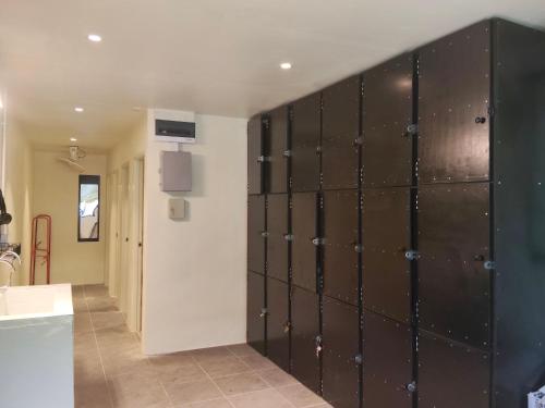 a room with a bunch of lockers in a room at JAM's HOSTEL in Koh Phangan