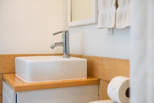 a bathroom with a sink and a toilet at Hotel Valle 13 Ruta del Vino in Valle de Guadalupe