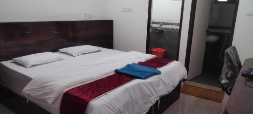 Ένα ή περισσότερα κρεβάτια σε δωμάτιο στο POP 84129A Kk Residency